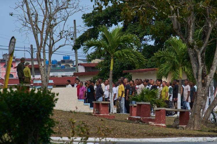 Photos of freed prisoners reuniting with families outside a Cuban prison