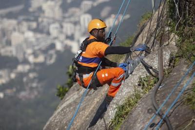 Rio de Janeiro climbers clean site of iconic Christ the Redeemer statue