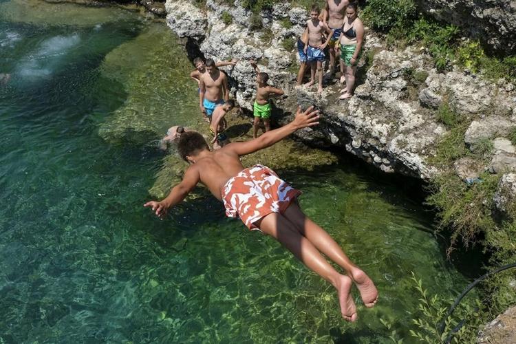 'It's hell outside': Sizzling heat wave in parts of southern and central Europe prompts alerts