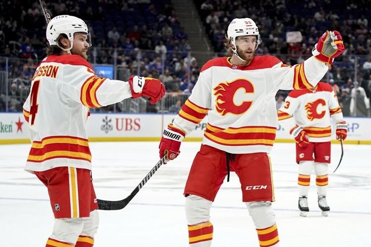 Dobson scores in OT to rally Islanders past Flames 4-3