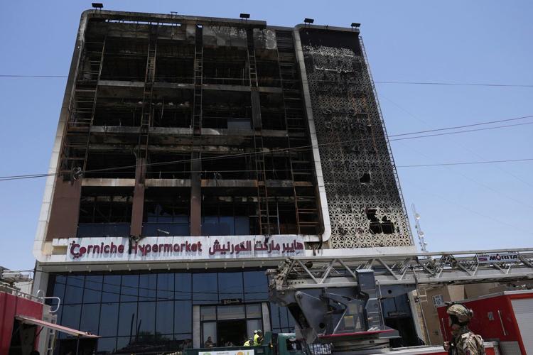 Officials try to identify 18 bodies in deadly Iraq shopping mall fire