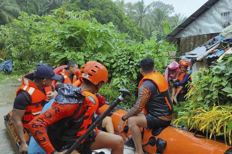 Storm floods northern Philippine regions, including capital, disrupting schools, work and travel