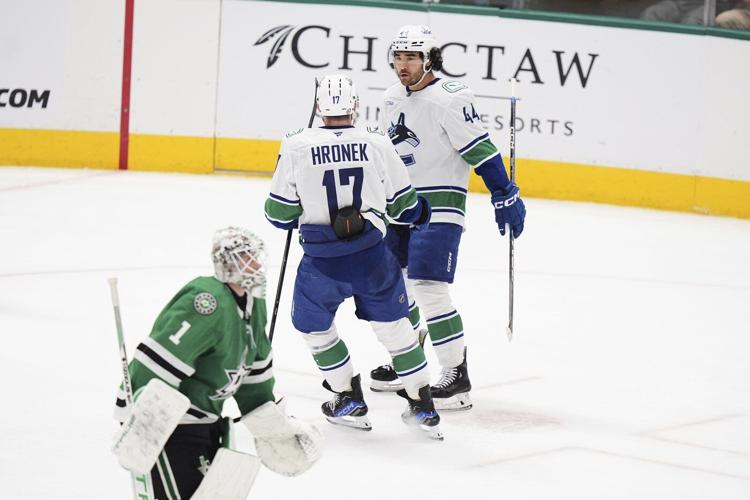 Sherwood's OT goal caps Canucks 3-goal comeback in final minute in 6-5 win over Stars