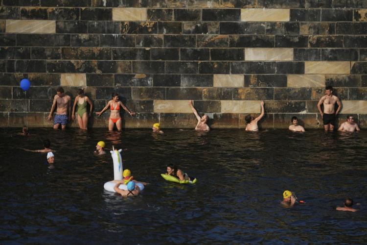 Berliners jump into the Spree River to show its clean enough for swimming