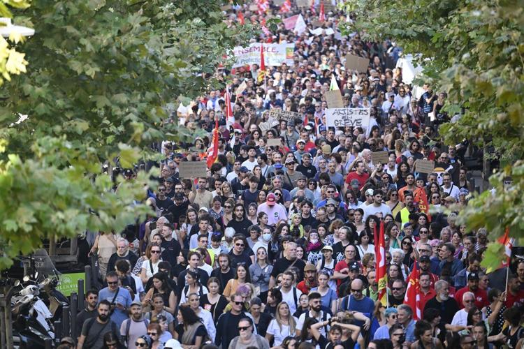 Protesters block roads and start fires across France to challenge the new prime minister, in photos
