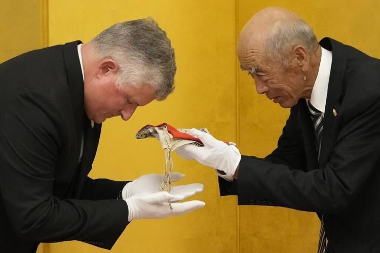 It's a miracle, say family of Japanese soldier killed in WWII, as flag he carried returns from US