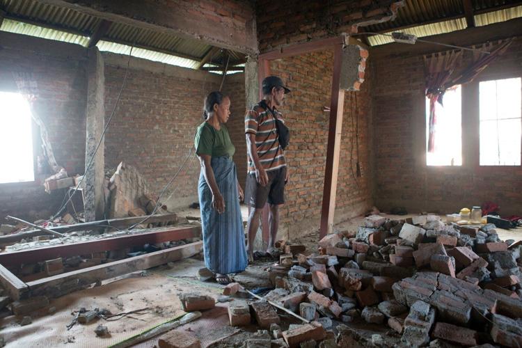 Rescuers dig through rubble and landslides after Indonesia quake kills 47