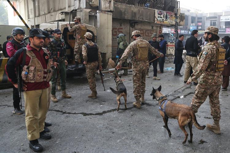 Suicide bombers strike security force headquarters in northwestern Pakistan, killing 3 officers