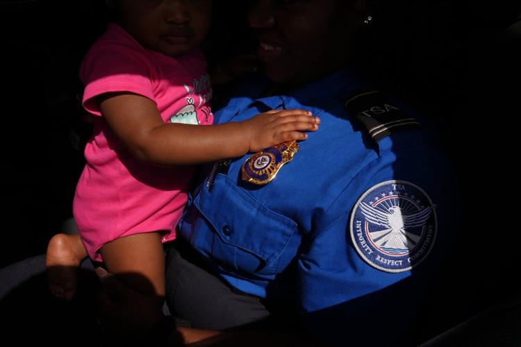 Photos of Americans turning to food pantries as shutdown drags on