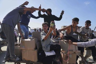 Organization denies AP report that US contractors at its Gaza food distribution sites used live ammo