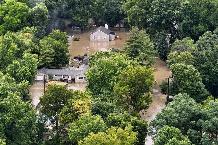 At least 6 people have died from days of storms and record-setting flooding in Indiana