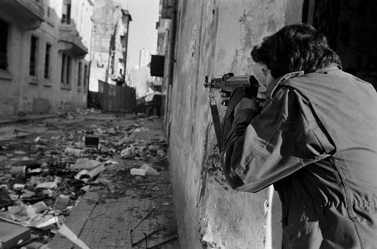 50 years after Lebanon's civil war began, a bullet-riddled bus stands as a reminder