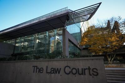 Judge overturns convictions of B.C. woman, accused of coughing on grocery worker