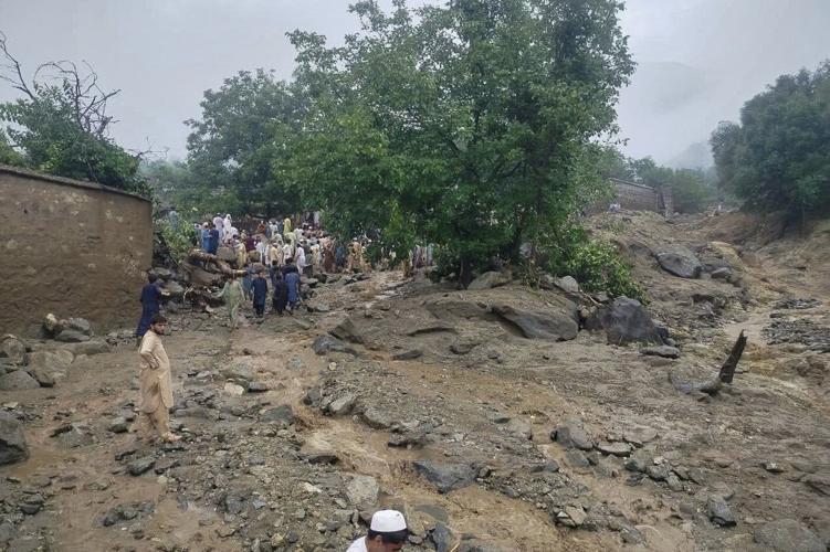 Flash floods triggered by heavy rains kill at least 49 people in northwestern Pakistan