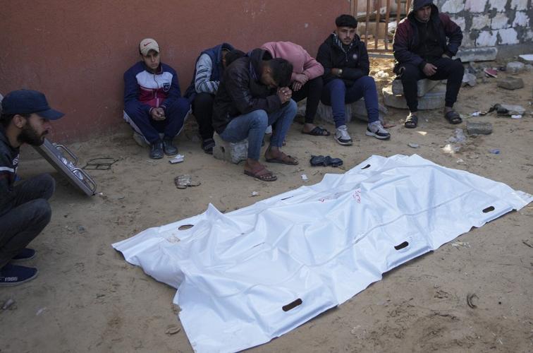 Israeli airstrikes in Gaza kill at least 21, hospital workers say, as talks underway