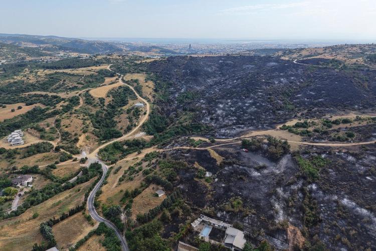 Wildfires kill a father and son in Greece and prompt evacuations in 2 villages