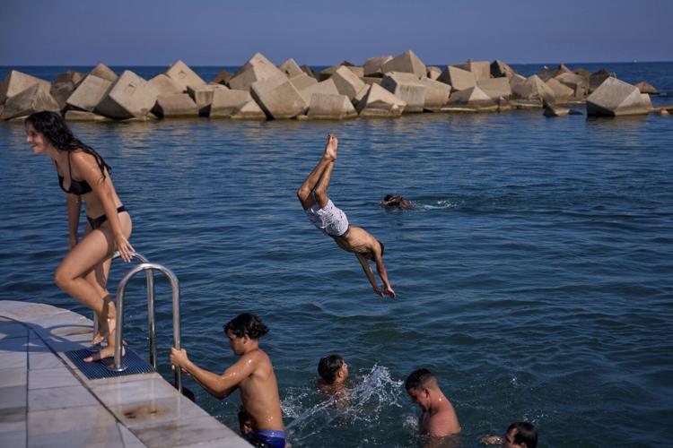 Barcelona records hottest June and Eiffel Tower's summit closes as Europe sizzles