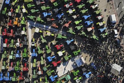 Protesting Greek farmers debate next moves after government offers some concessions