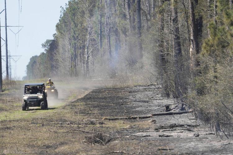 Texas wildfire prompts evacuations as Arkansas and Florida also battle blazes