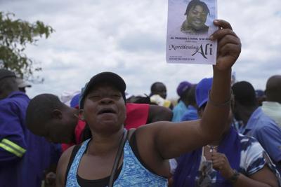 At the funeral of a slain Zimbabwean activist, clashes and a low turnout mirror opposition decline