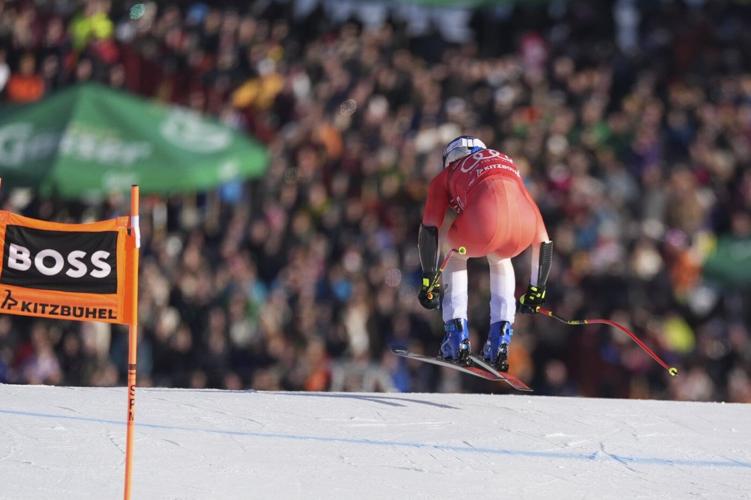 Swiss skier Marco Odermatt takes eventful World Cup super-G for 1st win in Kitzbuehel