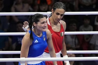 Algerian boxer Imane Khelif says she's 'never stayed down' and vows to fight back after lawsuit