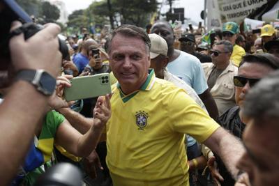 Lawmaker son of Brazil's Bolsonaro announces relocation to the US as father faces legal woes