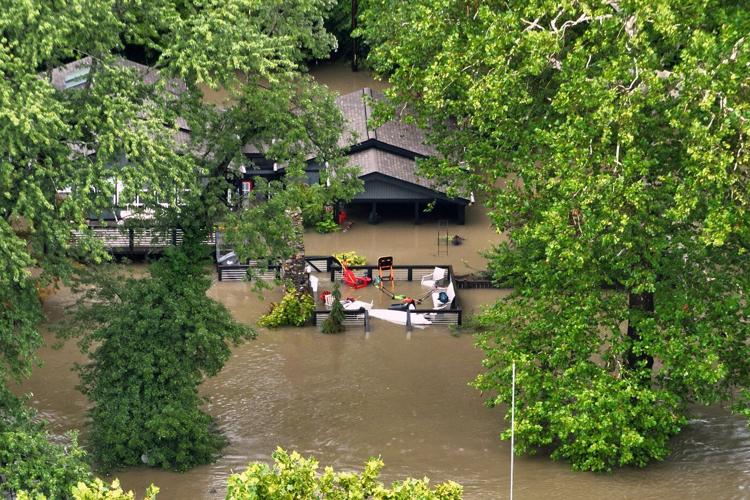At least 6 people have died from days of storms and record-setting flooding in Indiana