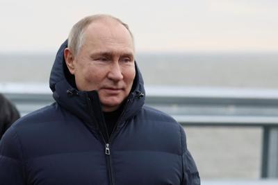 Russia's Putin drives across repaired bridge to Crimea
