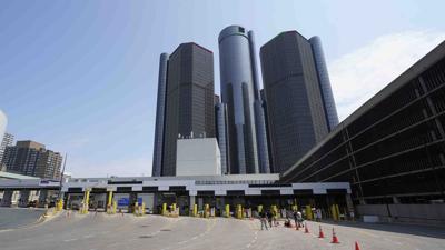 Losses in China lead to $5 billion charge for General Motors as it cuts the value of its assets