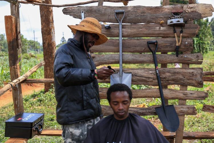 A Kenyan barber who wields a sharpened shovel thrives on Africa's social media craze