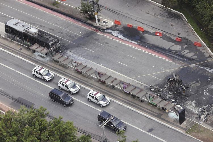 A small plane loses altitude after takeoff and slams into a Sao Paulo avenue, killing 2 passengers