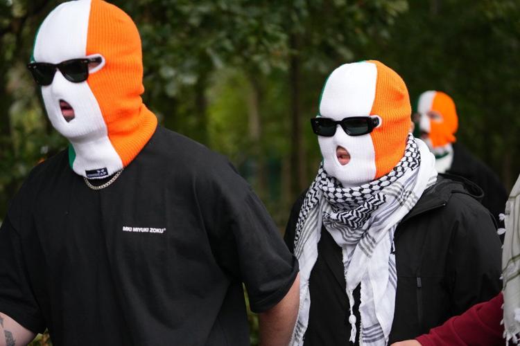 A British court throws out a terror-related charge against a member of the Irish rap group Kneecap