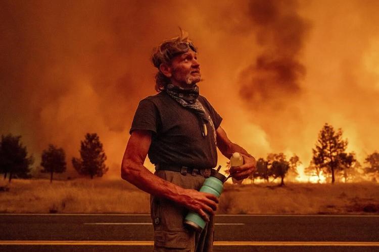Firefighters get some help from cooler temperatures after California's largest wildfire explodes