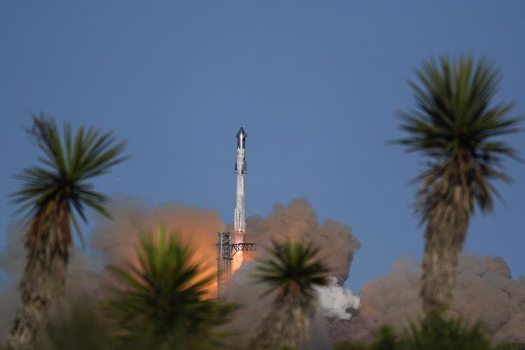 SpaceX launches giant Starship rocket, but aborts attempt to catch booster with mechanical arms
