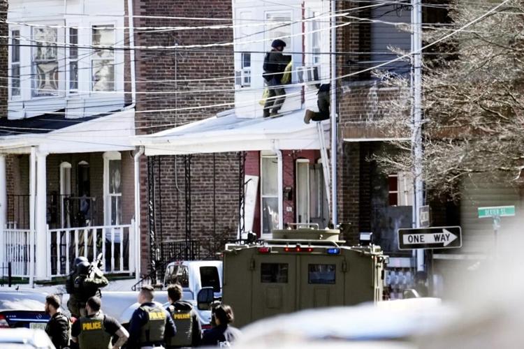 Man charged with killing 3 relatives is returned to Pennsylvania custody
