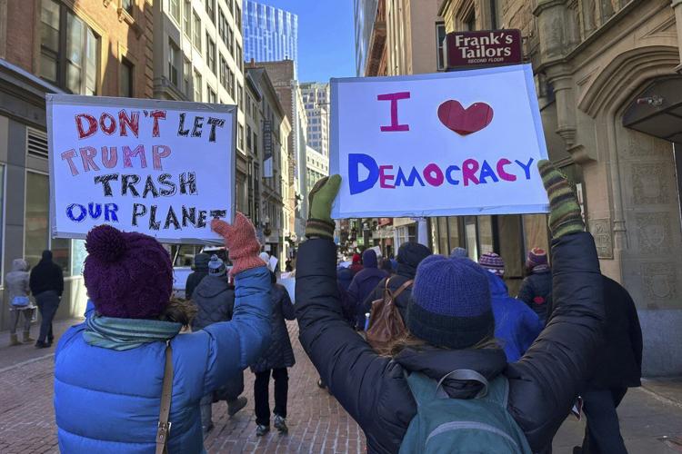 Hundreds march in Boston to support democracy and protest policies of Trump, Musk