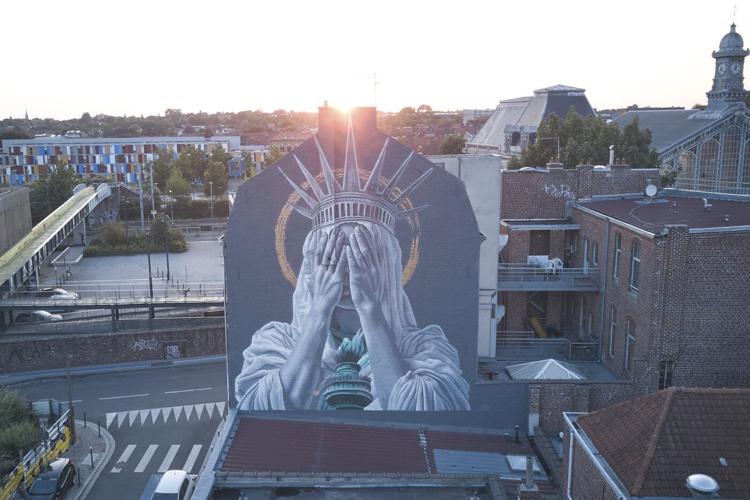 A new mural in France shows the Statue of Liberty covering her eyes in a swipe at Trump