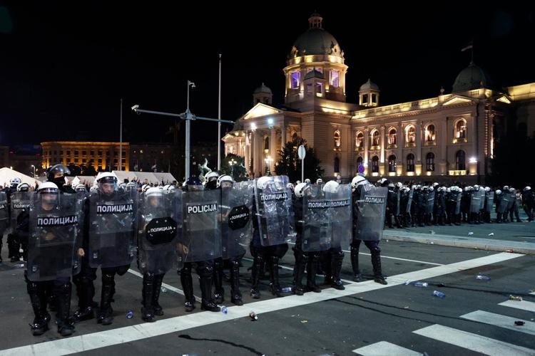 Riot police separate opponents, loyalists of Serbia's president as tensions soar amid protests