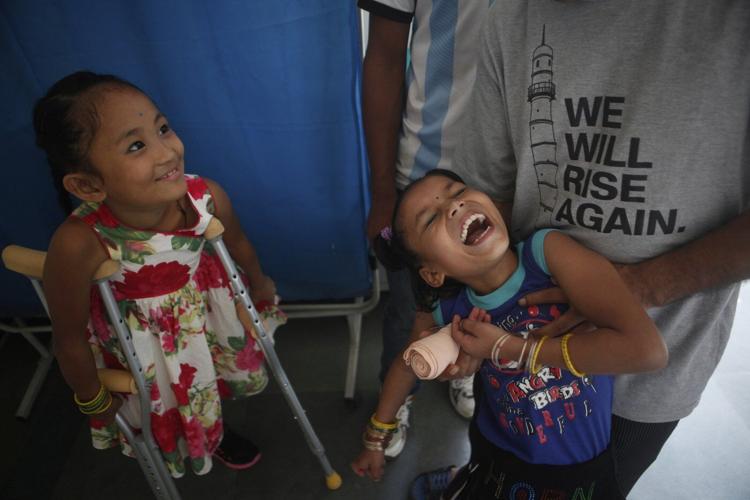 2 girls survived Nepal's 2015 earthquake. Each lost a leg, but found friendship in the hospital