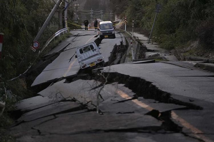 Rescuers race against time in search for survivors in Japan after powerful quakes leave 62 dead