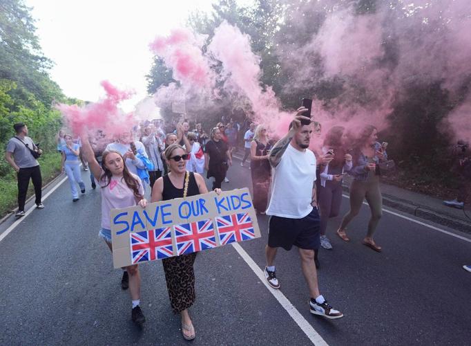 UK prosecutors say rocks and eggs thrown at police during asylum hotel protests