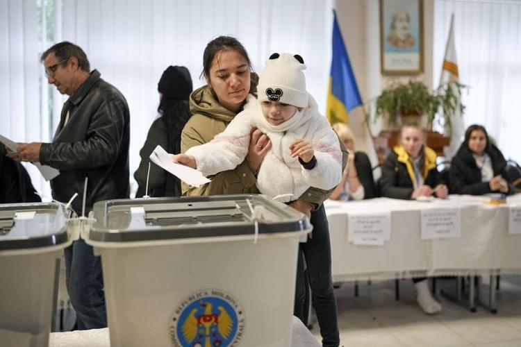 Moldovans cast votes to choose president and decide on EU path as Russian interference claims spike