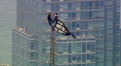 2 people arrested after hanging a banner about 'the power of love' on Empire State Building antenna