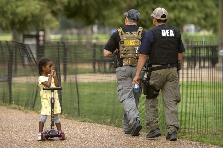 Photos of the ɫֱ Guard and federal agents in Washington