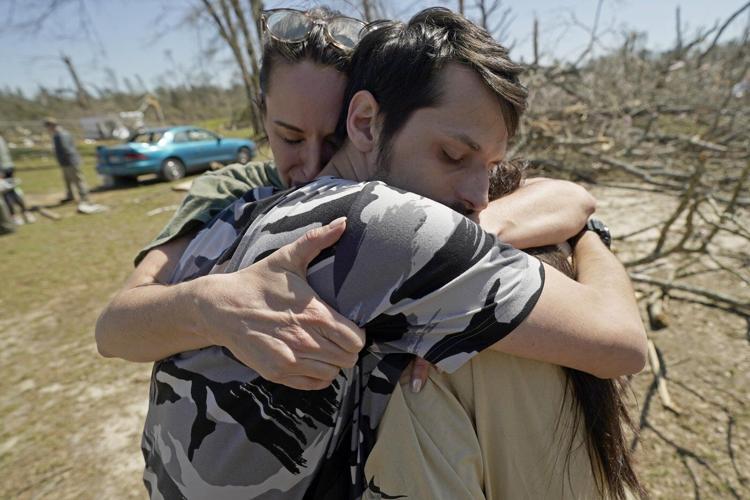 Residents pick up the pieces after devastating storms scour the US South and Midwest