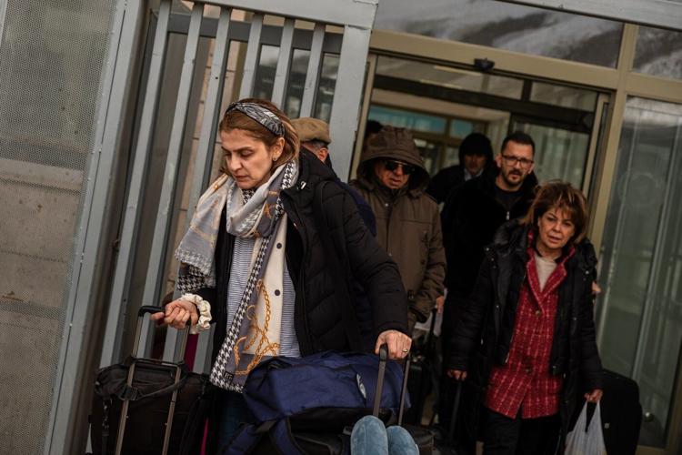 Iranians grapple with whether to flee the country because of the war
