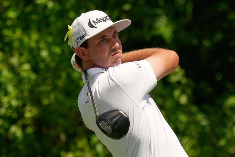J.T. Poston handles the wind at Memorial for low round of tournament and the lead