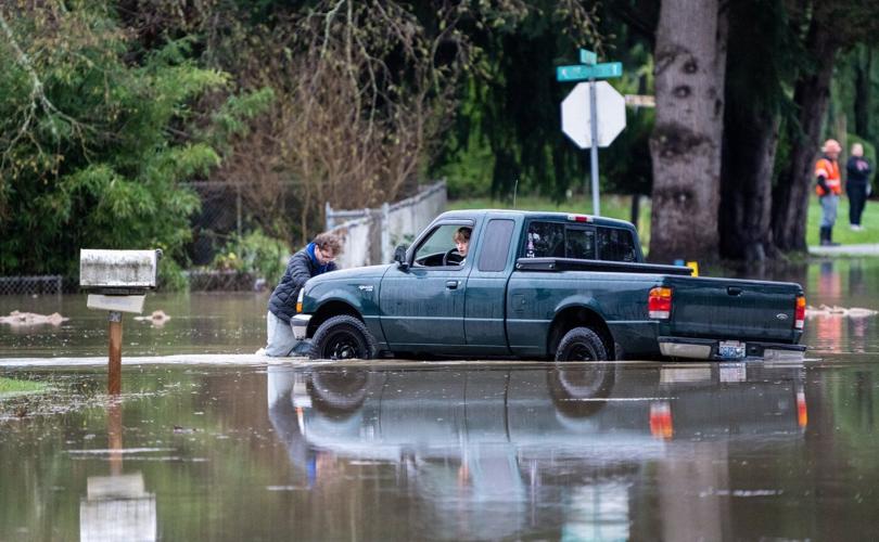 Arctic air sweeps south as residents of the Pacific Northwest remain on guard after severe flooding