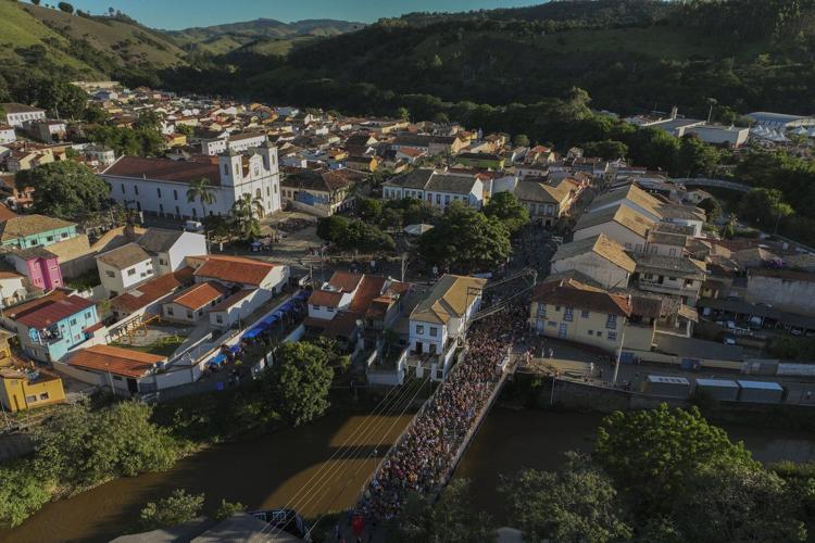 Families and revelers party side-by-side in a traditional Carnival in Sao Paulo's countryside